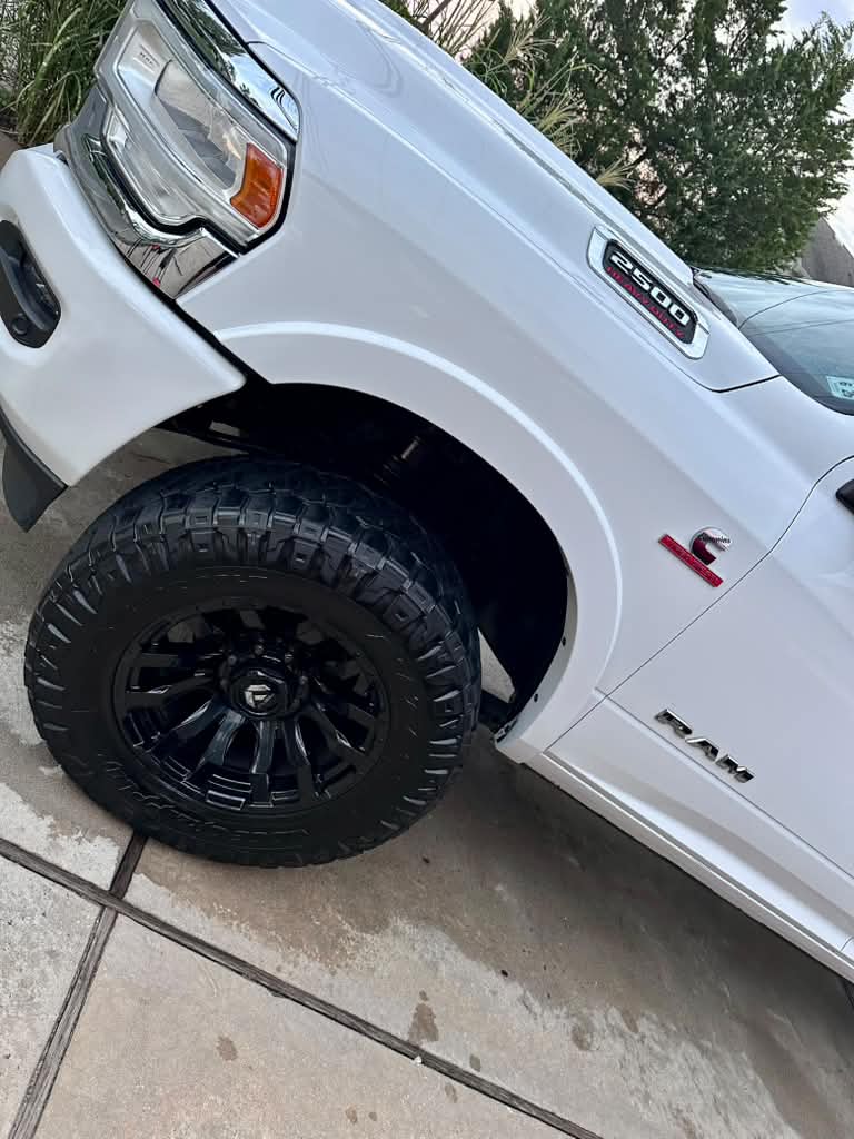 Detailed white Ram pickup wheel and bodywork